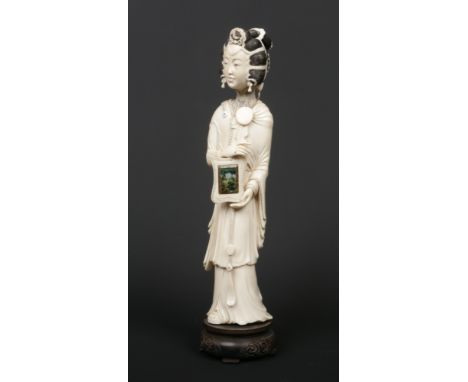 A 19th century Chinese carved ivory figure of a maiden wearing long flowing robes. With stained detail, turquoise inlay and h