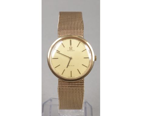 A gentleman's Omega De Ville 9 carat gold manual bracelet watch. With gold dial and baton markers cal. 620, 54.3 grams gross,
