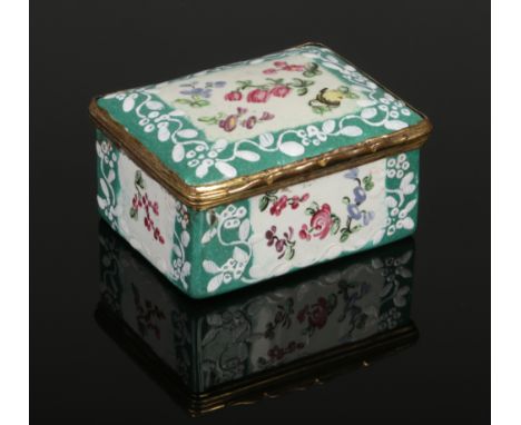 An 18th century enamel snuff box of rectangular form and with gilt metal mount. Green ground, painted with panels of flowers 