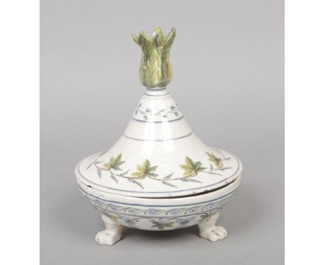 A 19th century Continental faience deskstand with flame taper stick finial and raised on three moulded paw feet. Opening to r