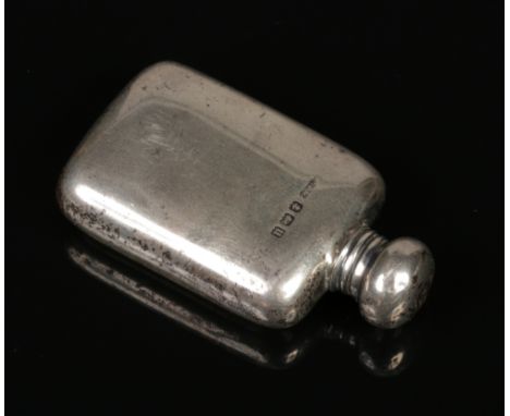 A George V novelty silver scent bottle formed as a miniature hip flask by Arthur &amp; John Zimmerman. Assayed Birmingham 191