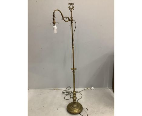An Edwardian brass standard lamp, height 157cmLamp is not adjustable, missing a screw by the light fitting.  Has large areas 