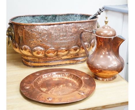 An 18th century Dutch beaten copper planter of elongated form with lion mask handles, beaten ship decoration and heavy gadroo