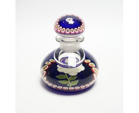 A rare Paul Ysart ‘white flower specimen’ glass inkwell or bottle and stopper, Caithness period, ‘PY’ cane, translucent blue 
