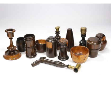A collection of 19th/20th century lignum vitae vessels and desk items, to include a pepper pot, salt pot, two desk seals, a w
