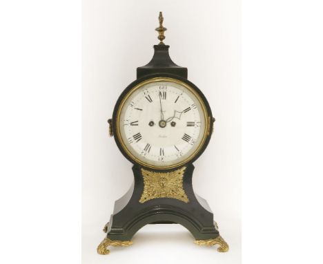 A Regency period ebonised balloon-shaped mantel clock,with gilt brass finial, handles and feet, the dial inscribed 'Thorp, Lo