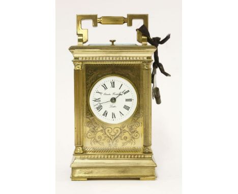 A modern brass carriage clock,the enamel dial inscribed 'Charles Frodsham, London' within an engraved brass face, the repeati