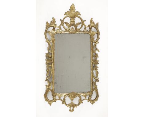 A carved giltwood wall mirror,in the rococo manner, surmounted with pierced scrolls and trailing flowers and leaves,56 x 115c