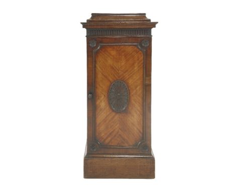 A George III mahogany pedestal, attributed to Thomas Chippendale, the stepped top over a fluted frieze with carved foliate co