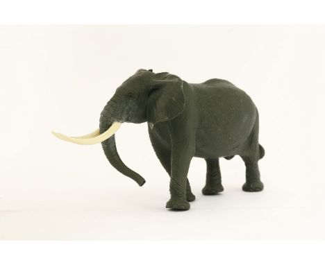 A jasper elephant,carved by Gerd Dreher (b.1939) and retailed by Asprey, signed with monogram on the base of one foot, in a b