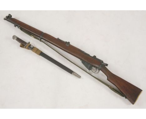 A Lee Enfield SMLE Mark III .303 rifle,stamped 'DP' to top of stock N7758 RIF 1924, deactivated with certificate, with a 1907