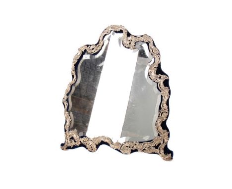 SILVER FRAMED DRESSING TABLE MIRROR,hallmarks for William Comyns, London 1901, of shaped outline, embossed with scrolls and f