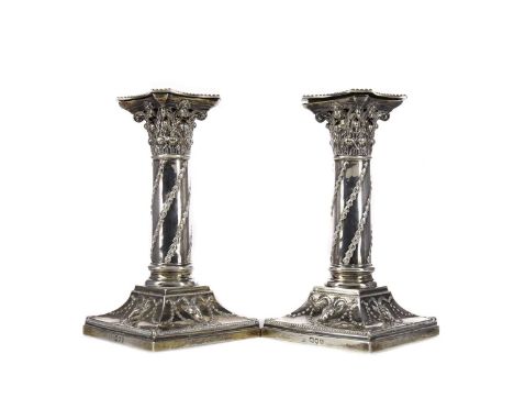 PAIR OF VICTORIAN SILVER CANDLESTICKS,maker William Hutton &amp; Sons, London 1893, with Corinthian capitals, swags and goat 