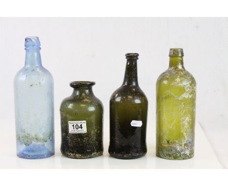 Four vintage Glass bottles to include Gin type