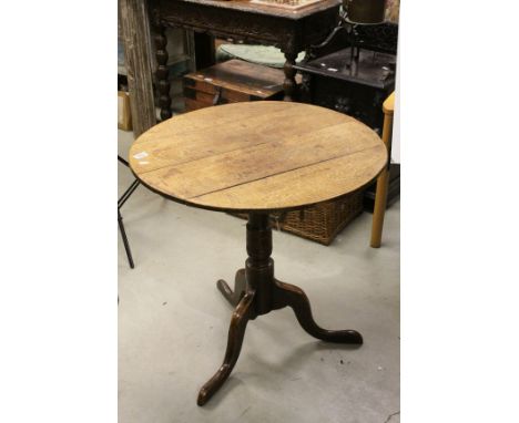 Georgian Oak Tilt Top Circular Table on turned and ringed pedestal base with tripod feet, approx 71cms diameter top