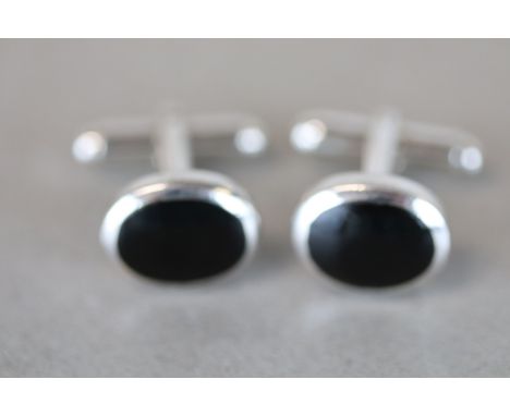 Pair of Silver Cufflinks set with Onyx