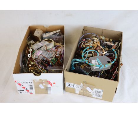 Two shoe boxes of assorted vintage costume jewellery to include necklaces, bangles, bracelets, beads etc (2)