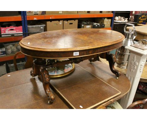 Victorian Burr Walnut Oval Coffee Table raised on four carved splayed legs with ceramic castors and cross-stretcher, approx. 