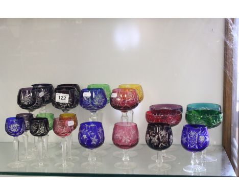 Collection of vintage cut glass drinking glasses with coloured flash overlay