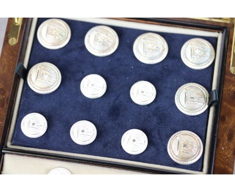 Cased set of Firmin & Sons buttons depicting a star and flag, comprising two sizes of button and a pair of matching cufflinks