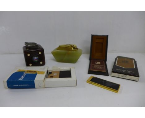A Ronson onyx table lighter, a dice shaped table lighter and two other table lighters 