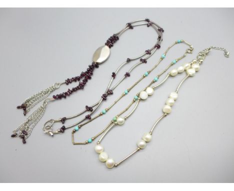 A silver and garnet necklace, a silver and turquoise necklace and a silver and pearl necklace 