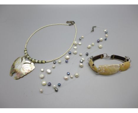 Mother of pearl jewellery including a carved butterfly pendant, a beaded necklace, panel bracelet, etc. 