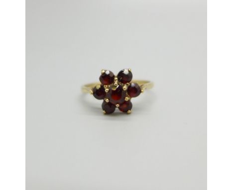 A 9ct gold and garnet cluster ring, 1.6g, M 