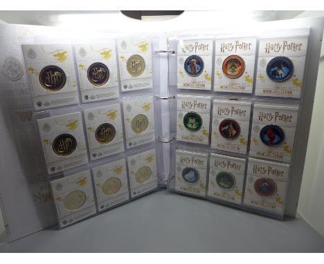 A Harry Potter album of 27 medals, depicting various characters from the famous books and films issued by Westminster Mint Ed