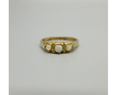 A 9ct gold ring set with three opals, 2g, M 