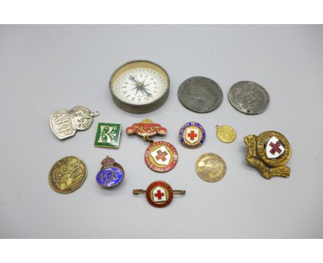 A compass, enamel badges, a silver ARP badge, etc. 