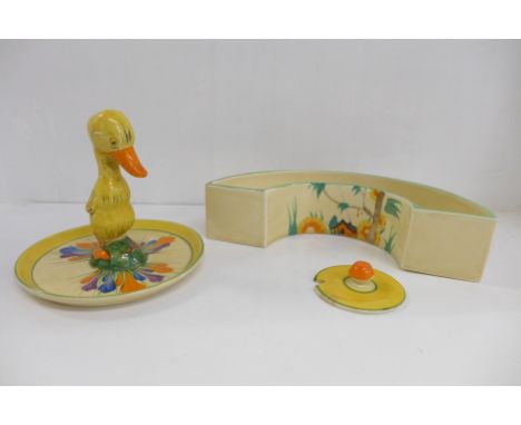 A Clarice Cliff Crocus Bizarre duck stand, a/f, a Wilkinson planter and an unmarked lid 
