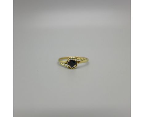 A 9ct gold and sapphire solitaire ring, 0.9g, M 