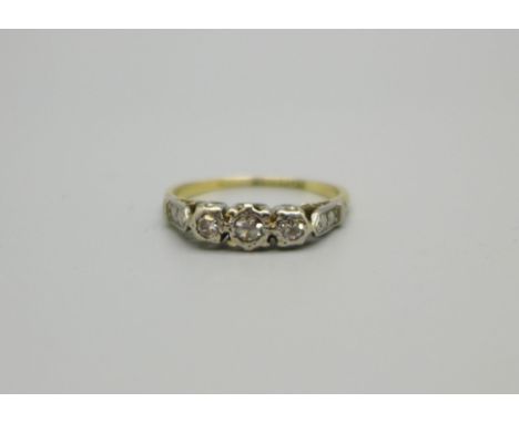 An 18ct gold, platinum set three stone diamond ring, 2.1g, J 