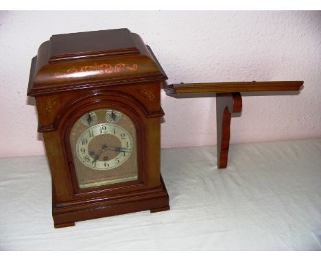 A Junghans B10 movement quarter Westminster chime mahogany cased bracket clock measuring 17" tall. CONDITION REPORT: Untested