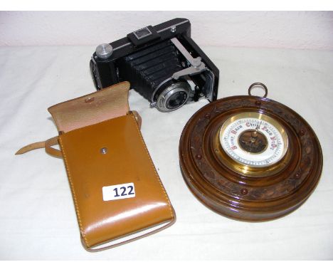 A Kodak 620 camera, an oak wheel barometer and two gilt wood framed pictures, the pictures 10" x 8". CONDITION REPORT: Good c