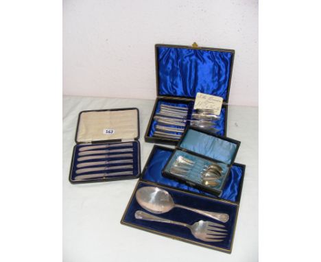 A cased set of sterling silver handled tea knives (hallmarked for Sheffield, each 16cm long), a cased plated spoon and fork, 