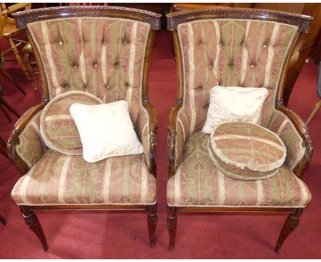 A pair of Baltic mahogany showframe tub parlour armchairs, each floral needlework striped button backed upholstered and raise