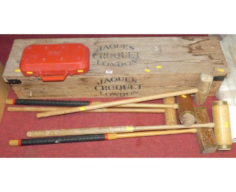 A Jaques croquet set in original box; together with a further selection of croquet mallets and balls
