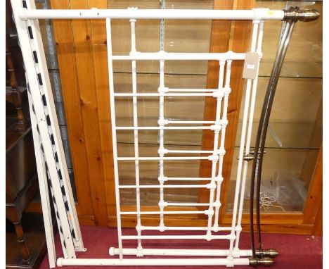 A contemporary white painted tubular metal double bedstead, in the Victorian taste, with side-rails, central column, and remo