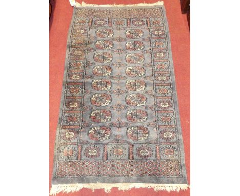 A Persian woollen blue ground Bokhara hall rug, 132 x 76cm 
