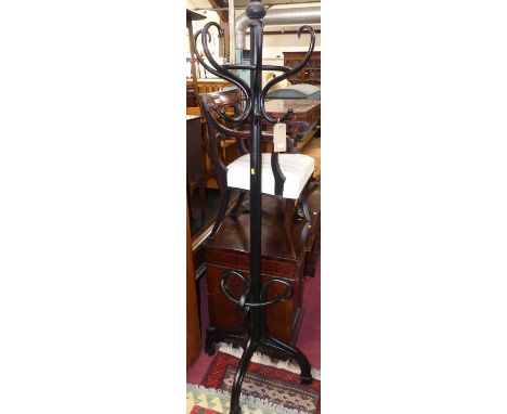 An early 20th century black painted bentwood half round combination coat, hat &amp; stick stand, height 203cm
