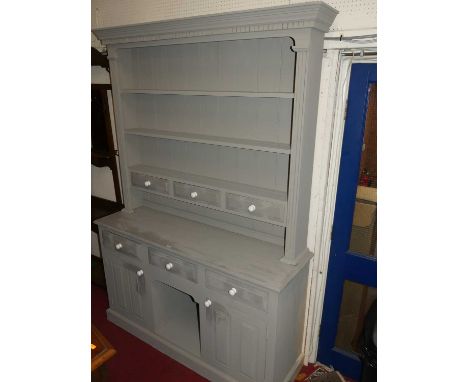 A contemporary grey painted pine kitchen dresser with white ceramic knob handles, height 213cm, width 150cm