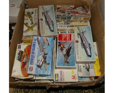 A box of Airfix, Revell and other mostly 1:72 scale boxed plastic kits, to include a Supermarine Spitfire Mk14 and a German F