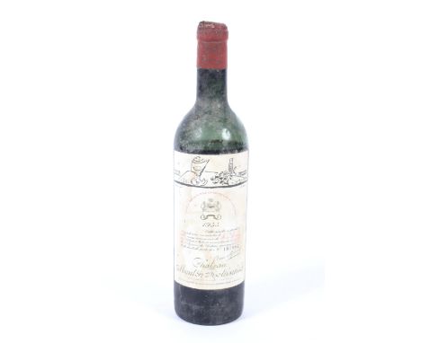 A bottle of vintage Chateau Mouton Rothschild 1955, numbered 107,982 (low neck). 
