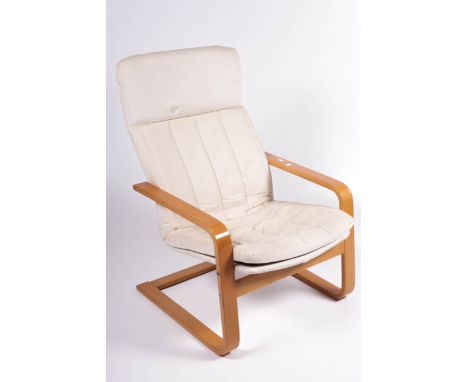 Vintage Retro : A Swedish Cantelever bentwood open armchair with cream upholstery. H94cm