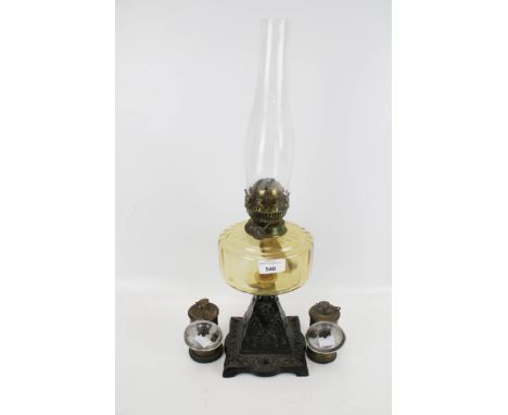 A pair of vintage cycle lamps and oil lamp. Consisting of two brass 'Premier' carbide lamps H10cm and a cast iron based oil l