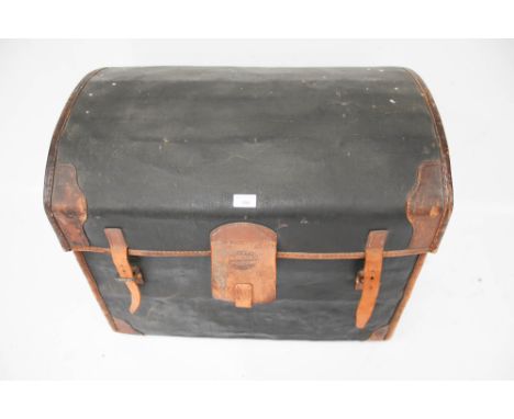 A vintage WM Insall &amp; Son, Bristol dome top wicker travelling trunk. With heavy leather reinforcement and straps, cotton 