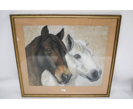 A chalk and pastel sketch of two horses. Monogram and dated, framed and glazed, 69cm x 57cm