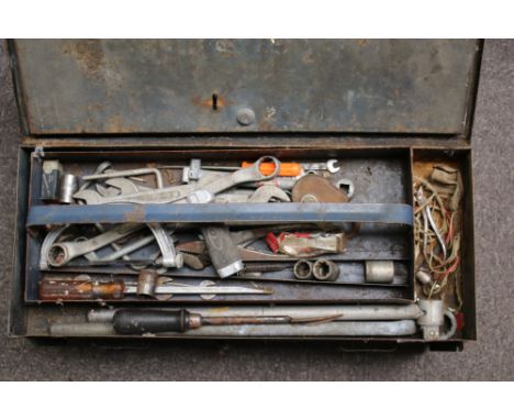 A vintage cast metal toolbox containing assorted tools. The box with handles to either side, L58cm, the tools including spann